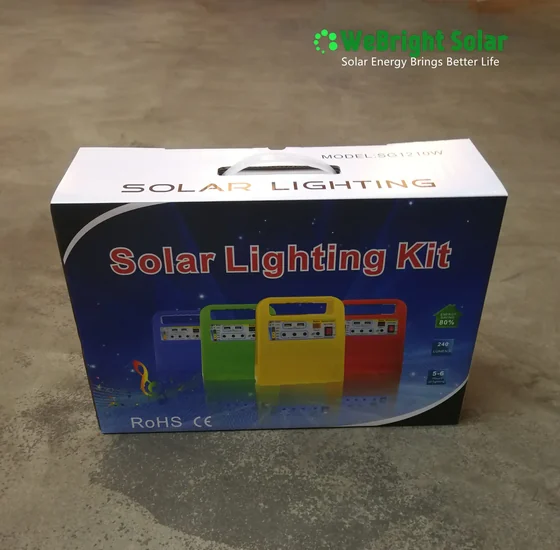 Cardboard box packaging for a solar lighting kit sitting on a concrete floor.