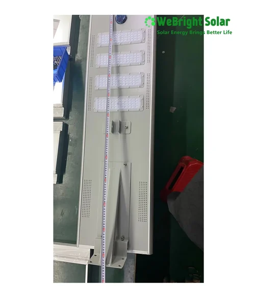 Back of a solar street light fixture with LED modules and a measuring tape.