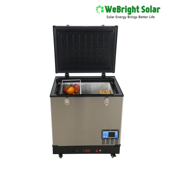 Stainless steel portable solar refrigerator with open lid showing fruit inside and digital control panel