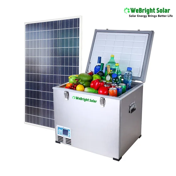 Silver chest freezer with open lid filled with groceries next to a solar panel