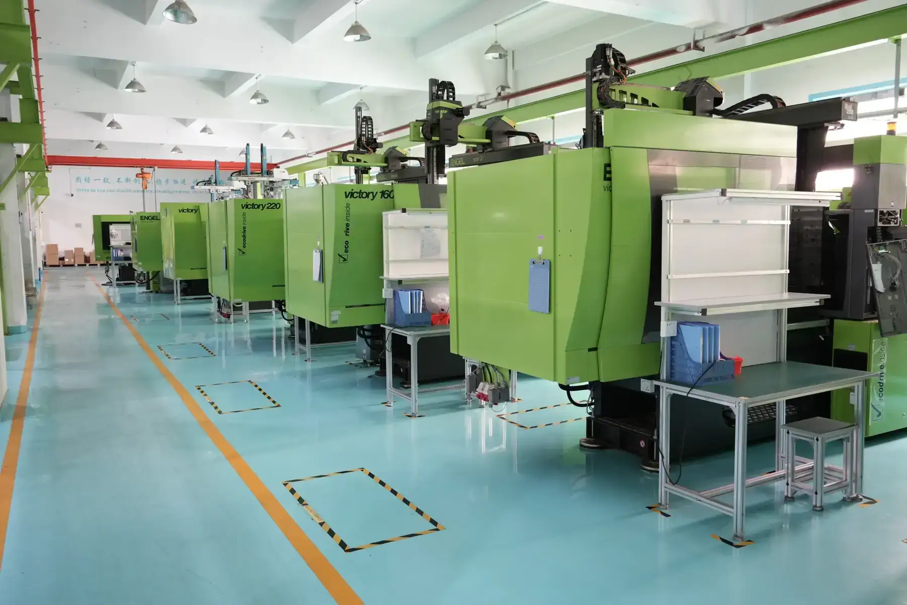 Row of injection moulding machines running production at the Shenzhen plant