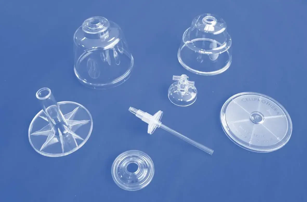 Transparent moulded housings and caps produced for precision assemblies
