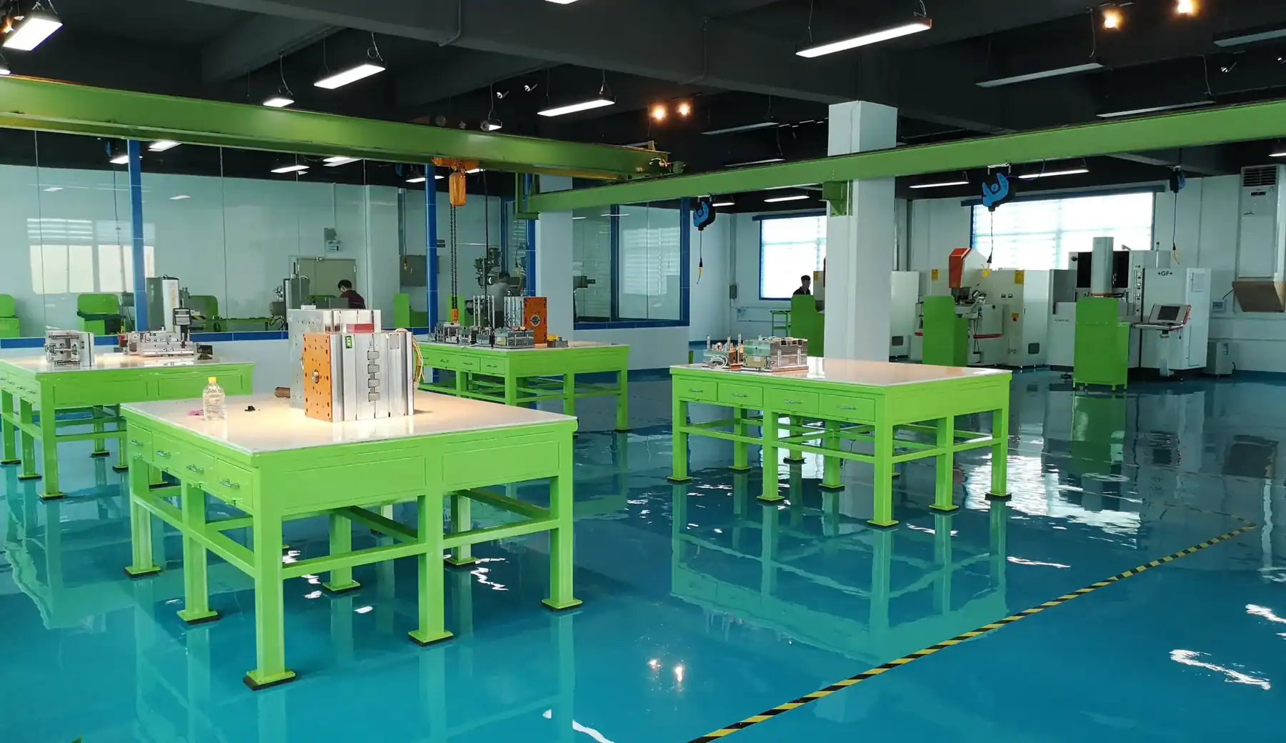 Production floor at the Shenzhen plant with assembly benches and machining cells
