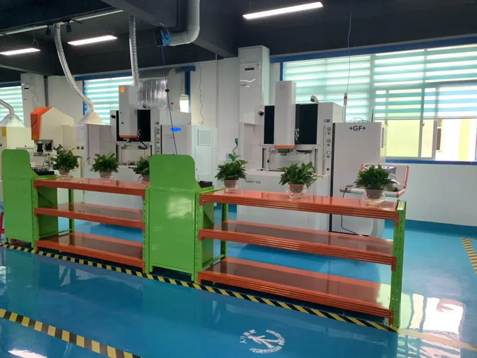 Production hall with machining cells behind a safety barrier at the Shenzhen site