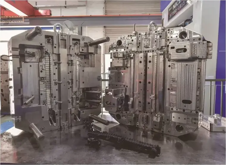 Large steel injection mould assembly standing in the tool room