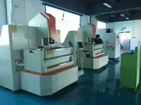 Row of precision grinding machines in the Wisdom Industrial tool room