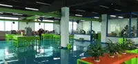 Workshop bay with assembly benches and machining equipment at the Shenzhen site