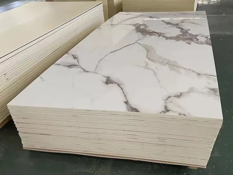 Stack of UV marble sheets with a white and grey veined marble surface