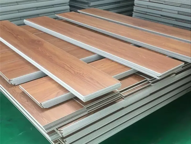 LVT flooring planks in a wood decor stacked on the factory floor