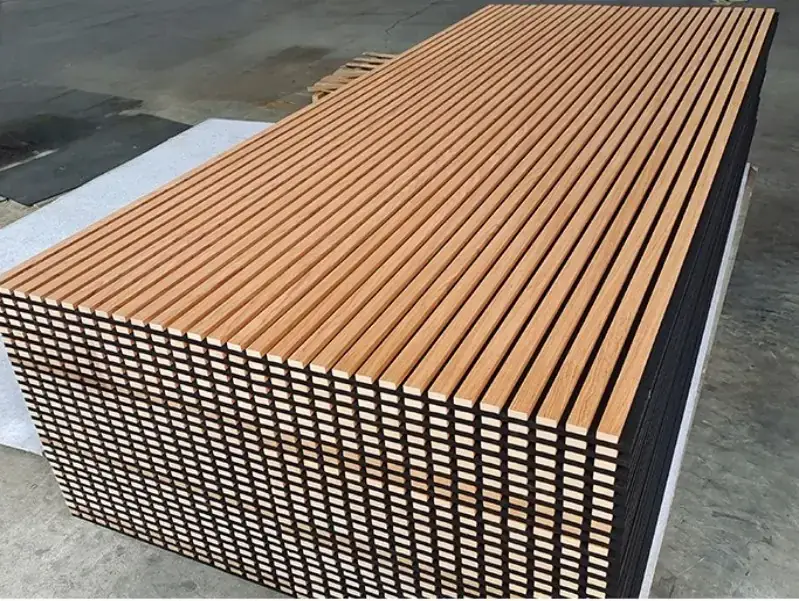 Stacked wood slat acoustic panels showing timber slats over a black felt backing