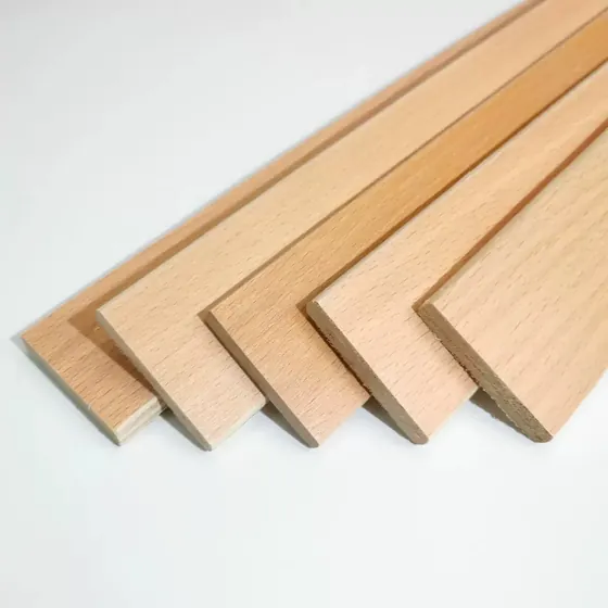 Birch bed slats stacked showing the laminated veneer edges