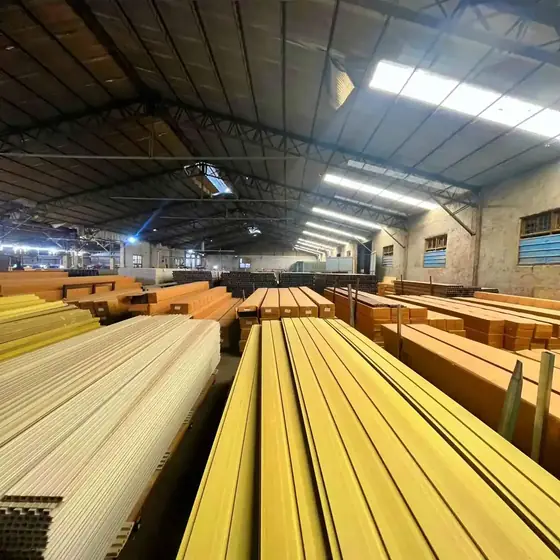 WPC wall panels and cladding boards stacked in the factory warehouse