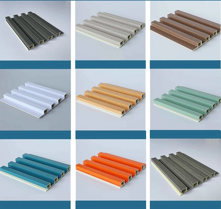 WPC interior wall panels in wood veneer finishes stacked to show the profile depth