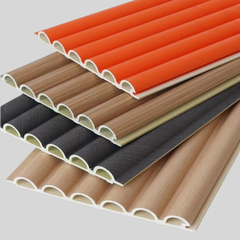 WPC interior wall panels in orange grey and wood tones showing the fluted profile