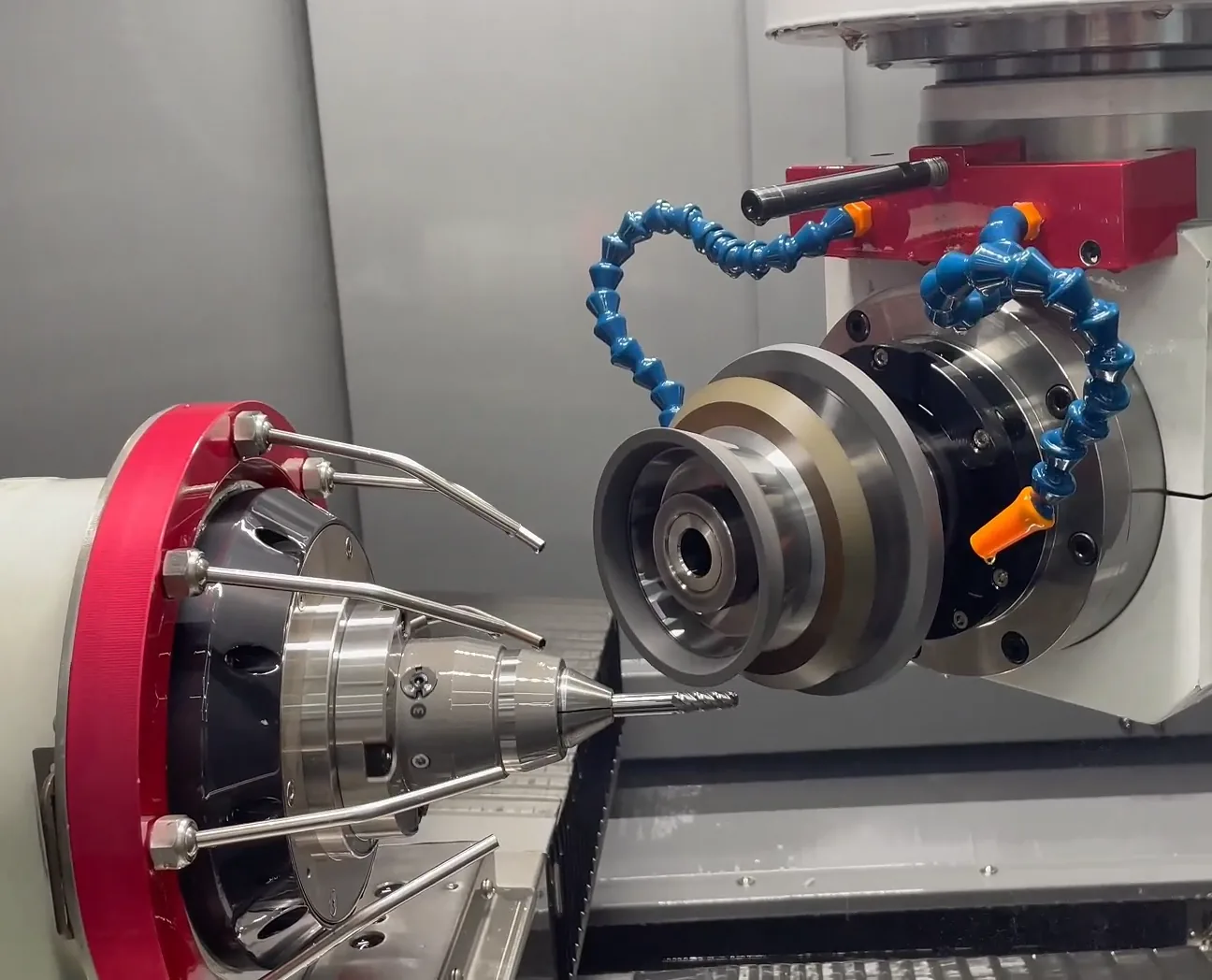 Five axis grinding operation on a carbide cutter inside a machine enclosure