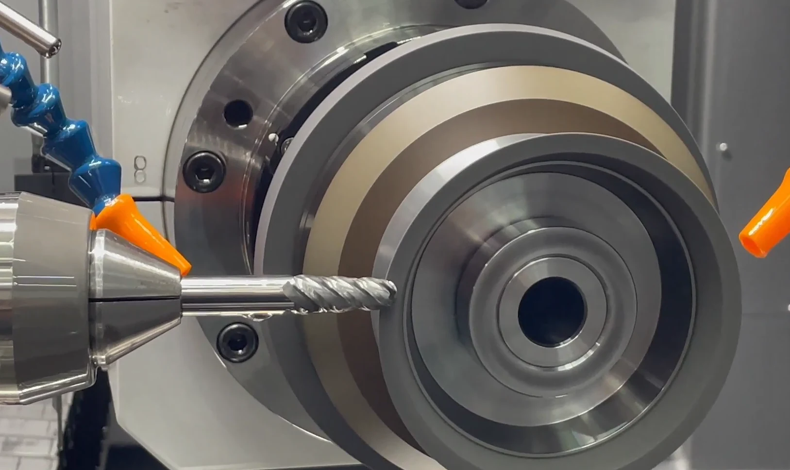 Grinding wheel engaged on a precision component during a test cut