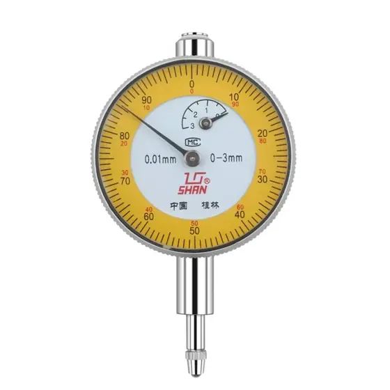 Dial bore gauge with dial indicator mounted on a long stem gauge body shown with a set of interchangeable anvils