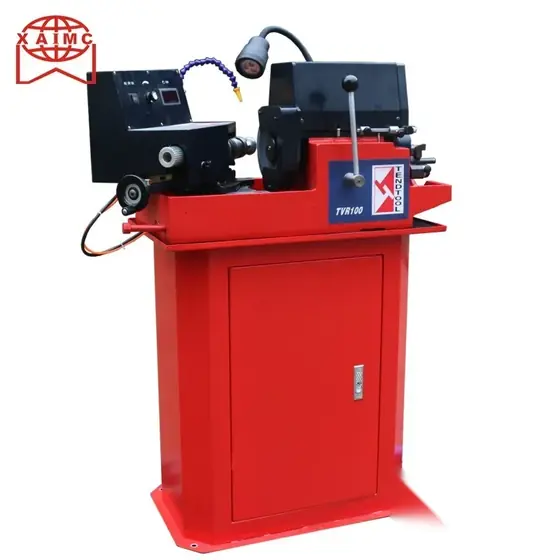 TVR100 valve grinder with horizontal chuck head grinding wheel guard and control panel on a floor-standing cabinet base