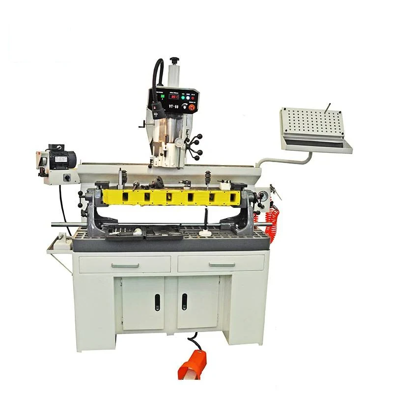 VT60 valve guide and seat cutting machine with tilting work head and long head fixture on the machine table