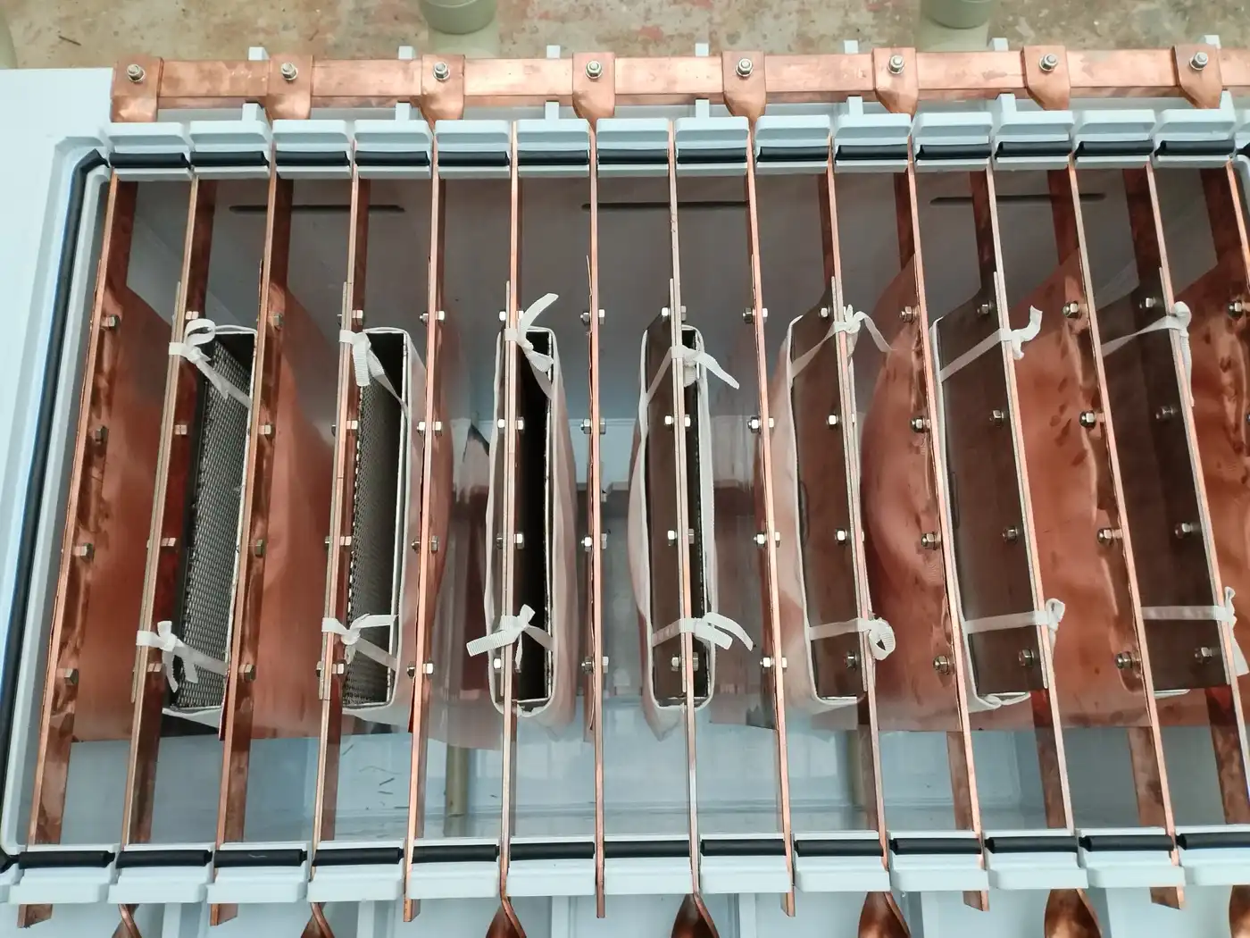 Copper anodes and titanium cathodes in the copper electrolysis refining cell