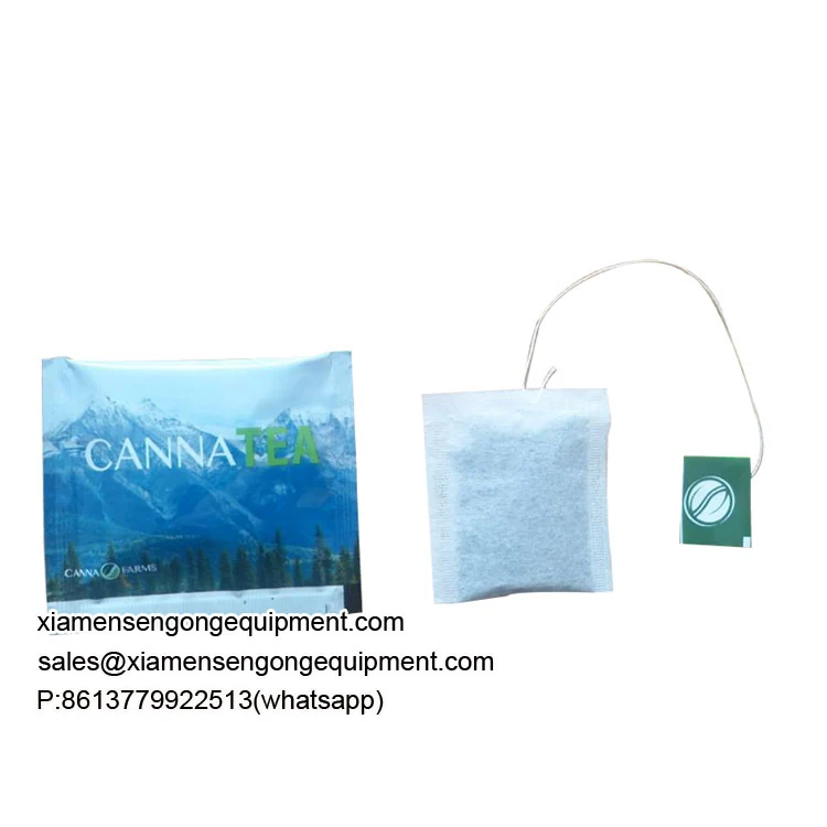C18 tea bag packing machine in operation with composite material rolls and tag attachment