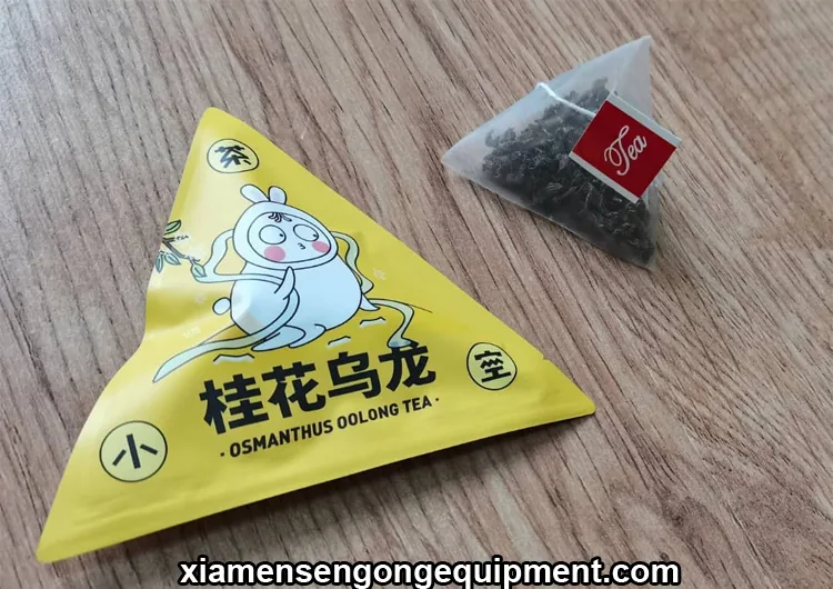 Pyramid tea bag packaging process with film unwinding and bag forming