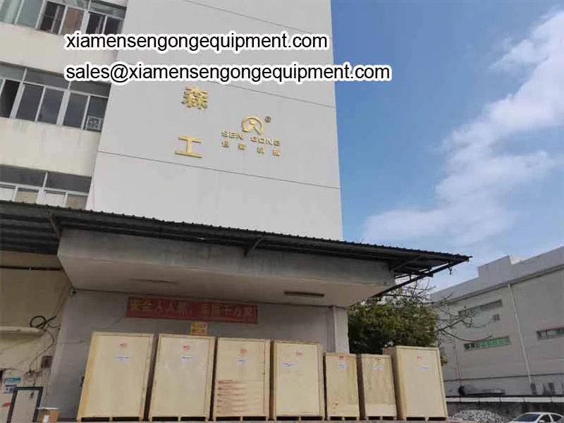 The Sengong factory building in Jimei District Xiamen with crated machines waiting for collection