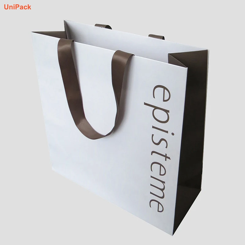 Branded paper shopping bag in white art card with printed logo