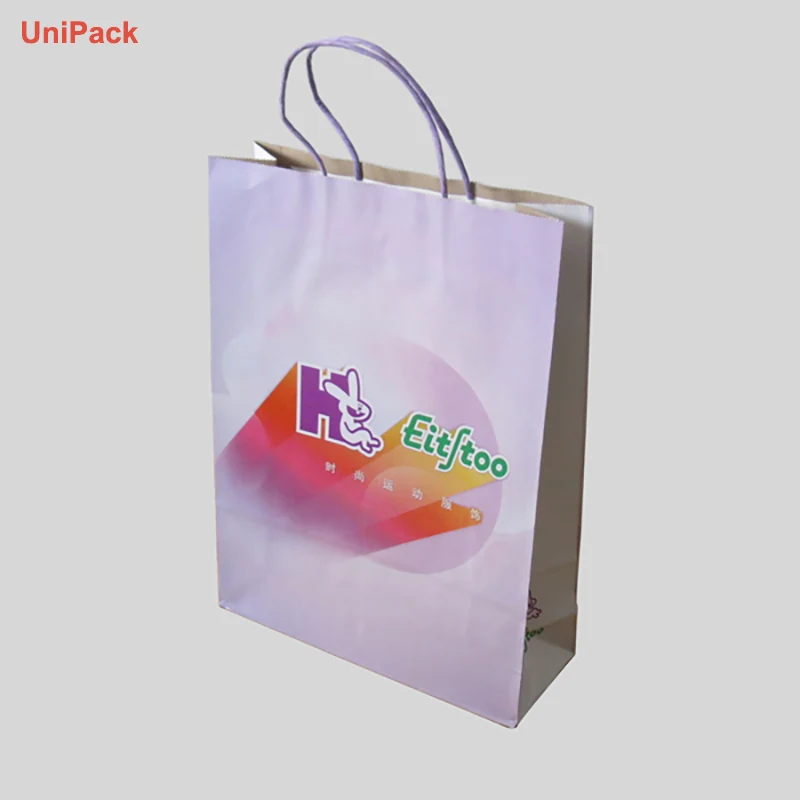 Brown kraft paper bag with red twisted paper handles