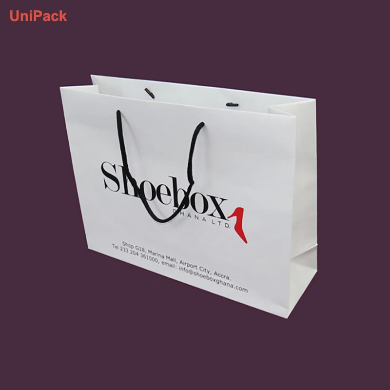 Custom printed white art paper retail bags in several sizes