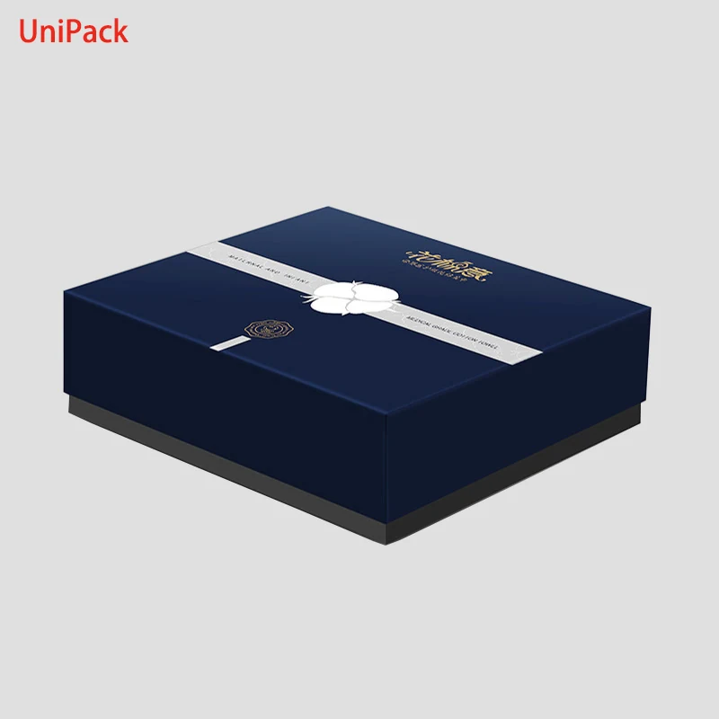 Gift packaging box in coloured paper with gold foil stamped detail
