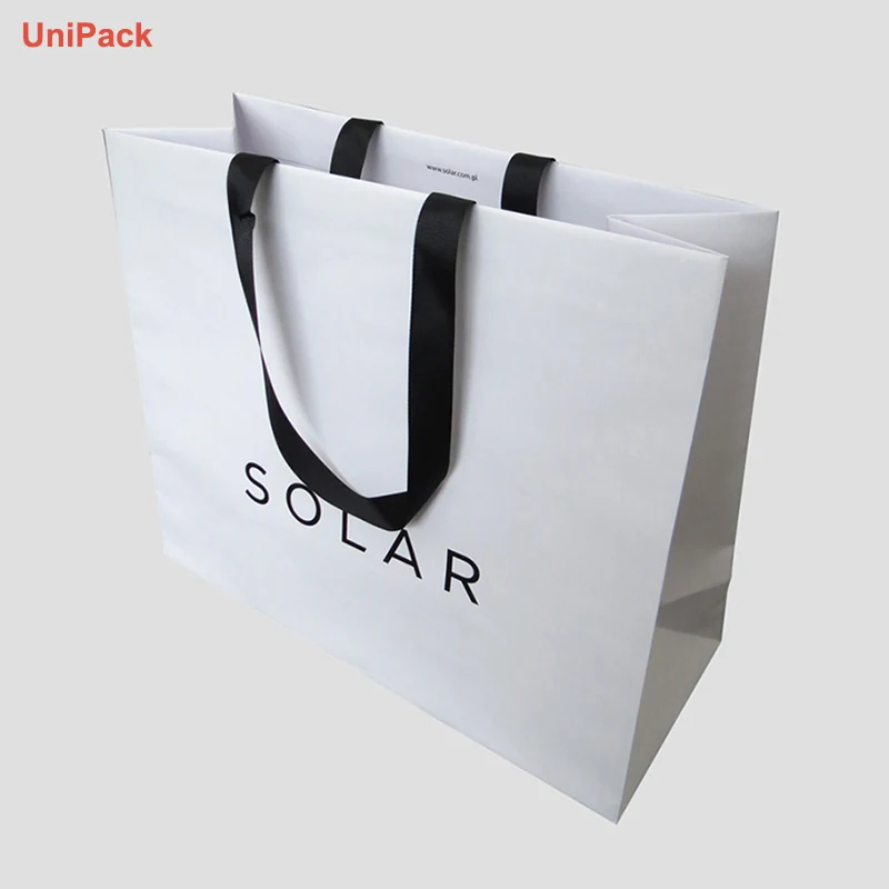 White kraft euro paper carrier bag with gold foil stamped brand logo