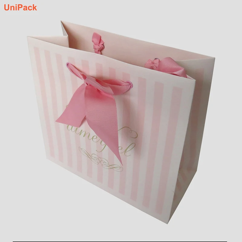 White art card luxury paper shopbag standing upright with printed branding