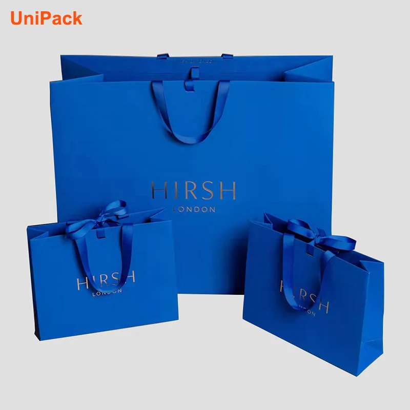 White euro shopping bag with gold foil stamped logo on printed background