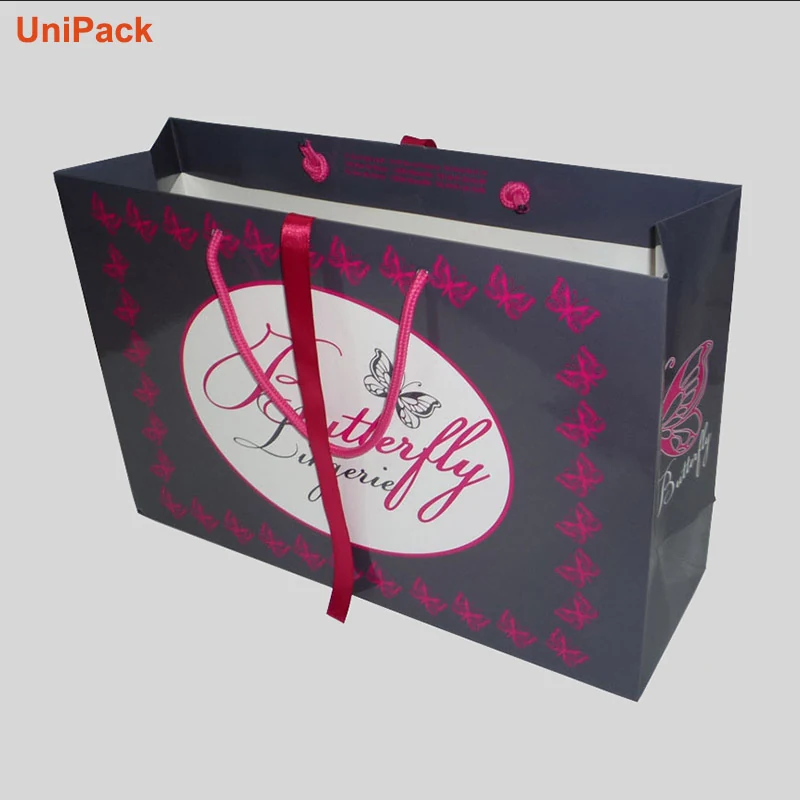 Printed paper shopbag with satin ribbon handles on white art card