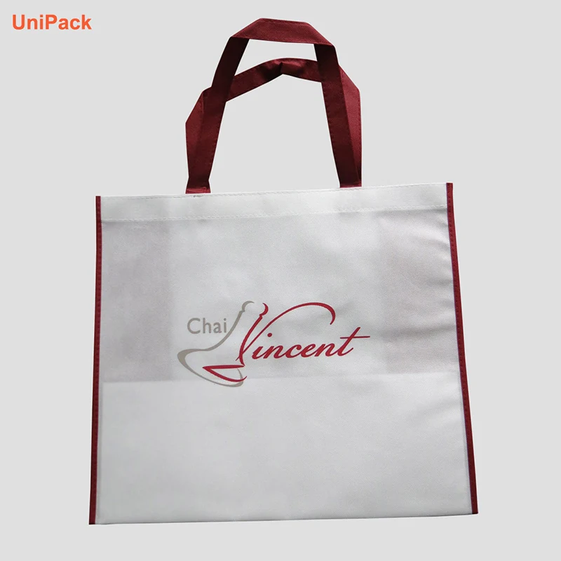 Reusable coloured nonwoven carrier bag with own logo printed on the side