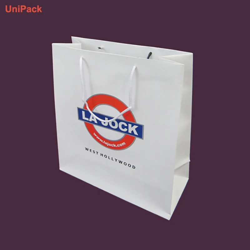 Customized printed paper retail bags in white art paper with matching branding