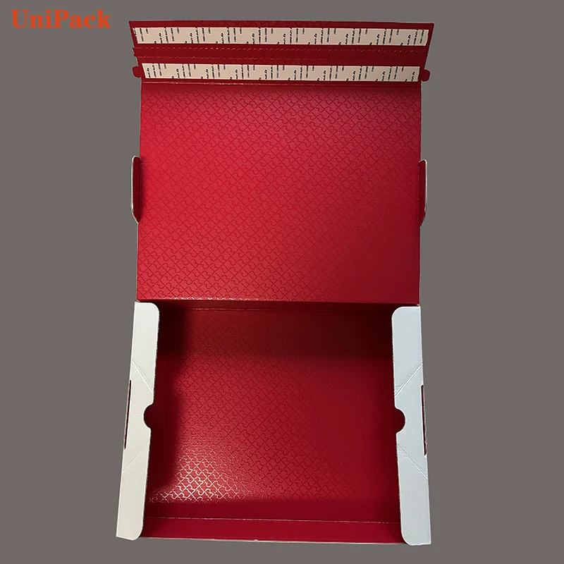 Corrugated down jacket box in dyed paper with red foil logo and tear strip