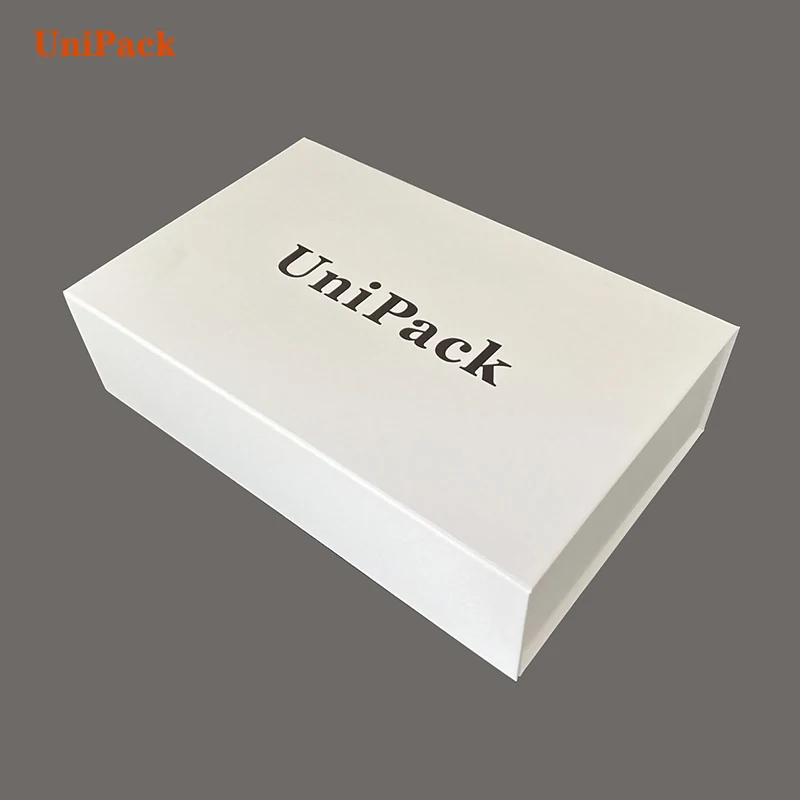 Magnetic foldable gift box in art paper with matt gold foil stamped logo