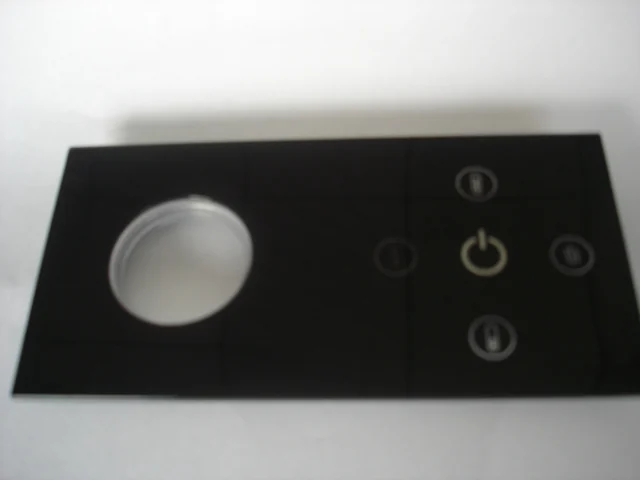 Injection moulded appliance control panel with moulded-in button cut-outs