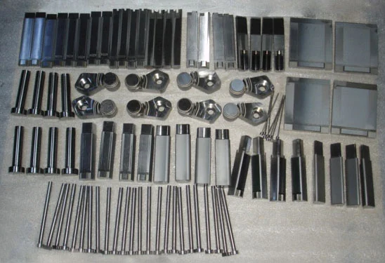 Set of machined mould components including guide pillars, bushings and slide blocks