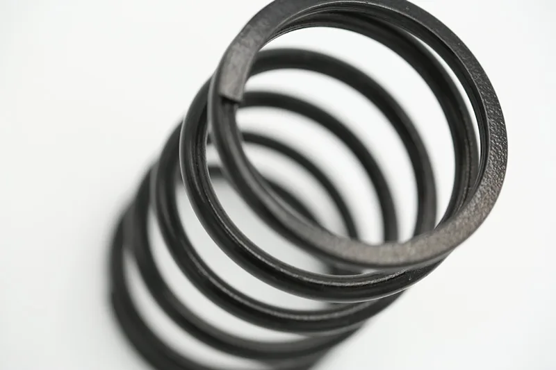 Carbon Steel Black Coated Ground Compression Spring Second Style manufactured by Xinshunyan