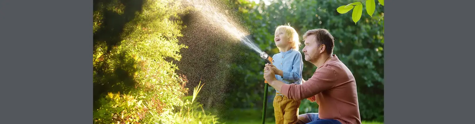 Garden watering products in use on a lawn