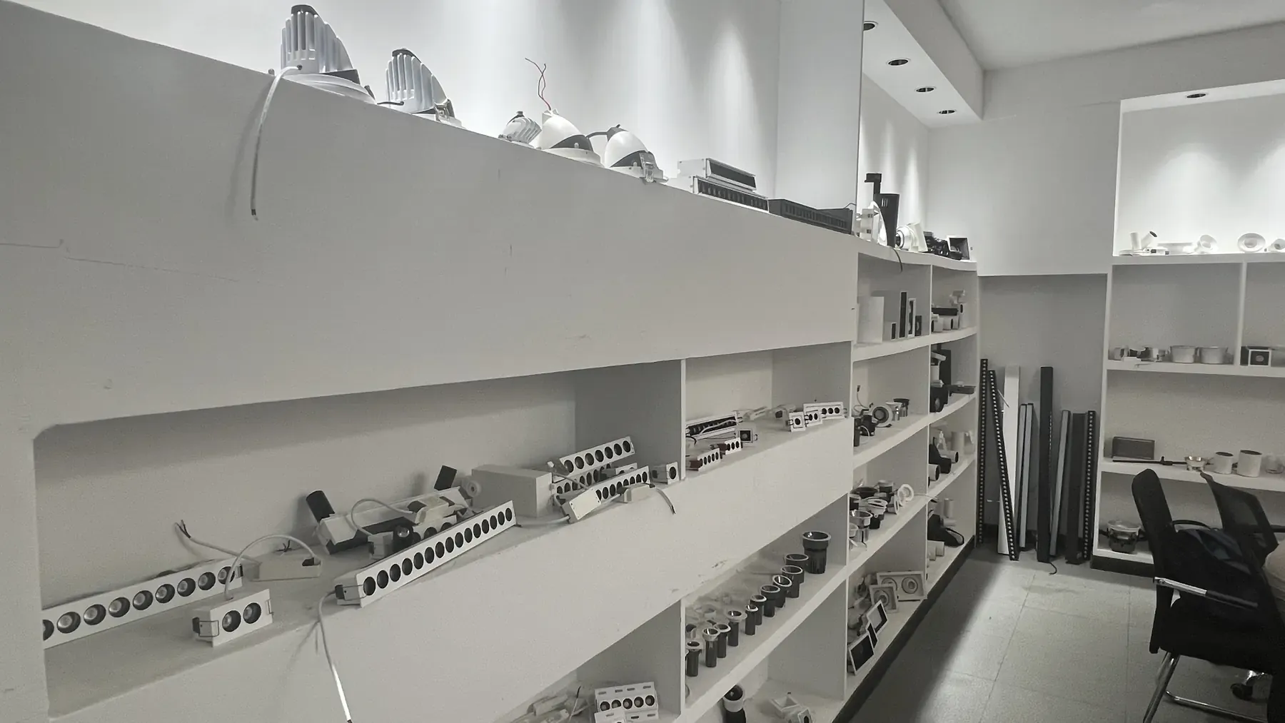 YiYo Lighting showroom wall of recessed spotlights and track heads