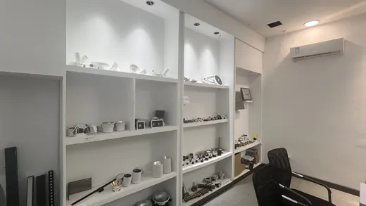 Showroom shelving holding downlights, spotlights and grille lights