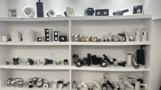 Sample wall of LED spotlight and grille light heads in several finishes