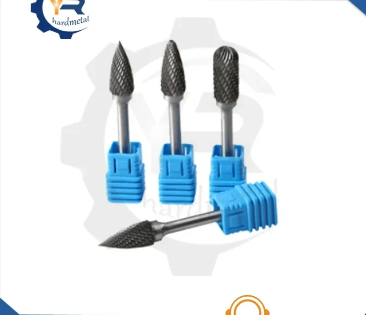 Four carbide rotary burrs with blue handle sleeves arranged on a plain white background