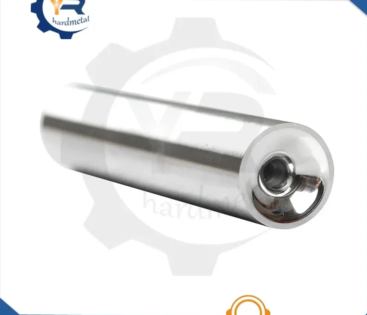 Polished tungsten carbide cylindrical nozzle blank with center bore shown diagonally on white background