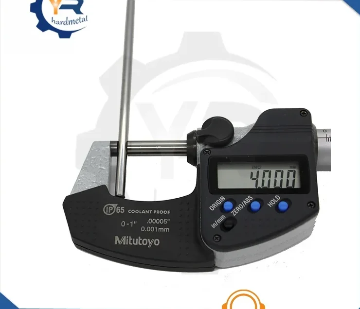 Digital micrometer reading 4.000 measuring a slim tungsten carbide rod on a white background