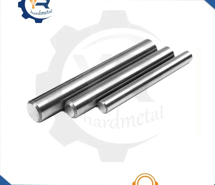 Three polished tungsten carbide rods of varying lengths lying diagonally on a white background